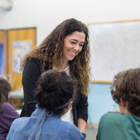 Teacher smiling with students