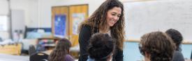 teacher smiling with students