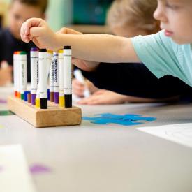 Children at table with markers