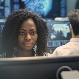 Students working in a computer lab reviewing data