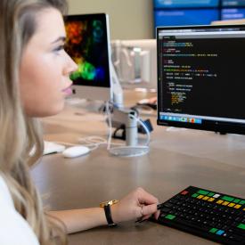 Person analyzing data on a monitor