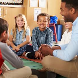 Teacher working with children