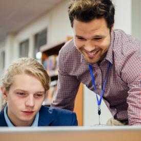 Teacher working with students