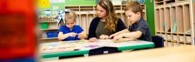 Teacher working with children