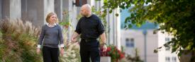 Catholic priest talking with person 