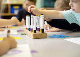 child choosing markers