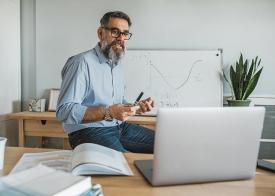 Business man leading online discussion